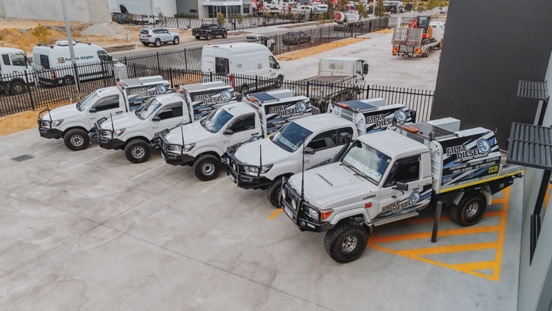 Mechanic inspecting transmission components during a gearbox rebuild