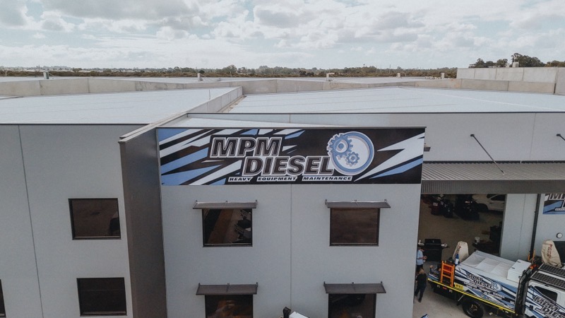 Welding structural steel frame on a mining service vehicle