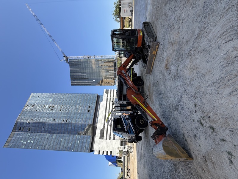 Auto electrician diagnosing wiring harness faults on a heavy vehicle